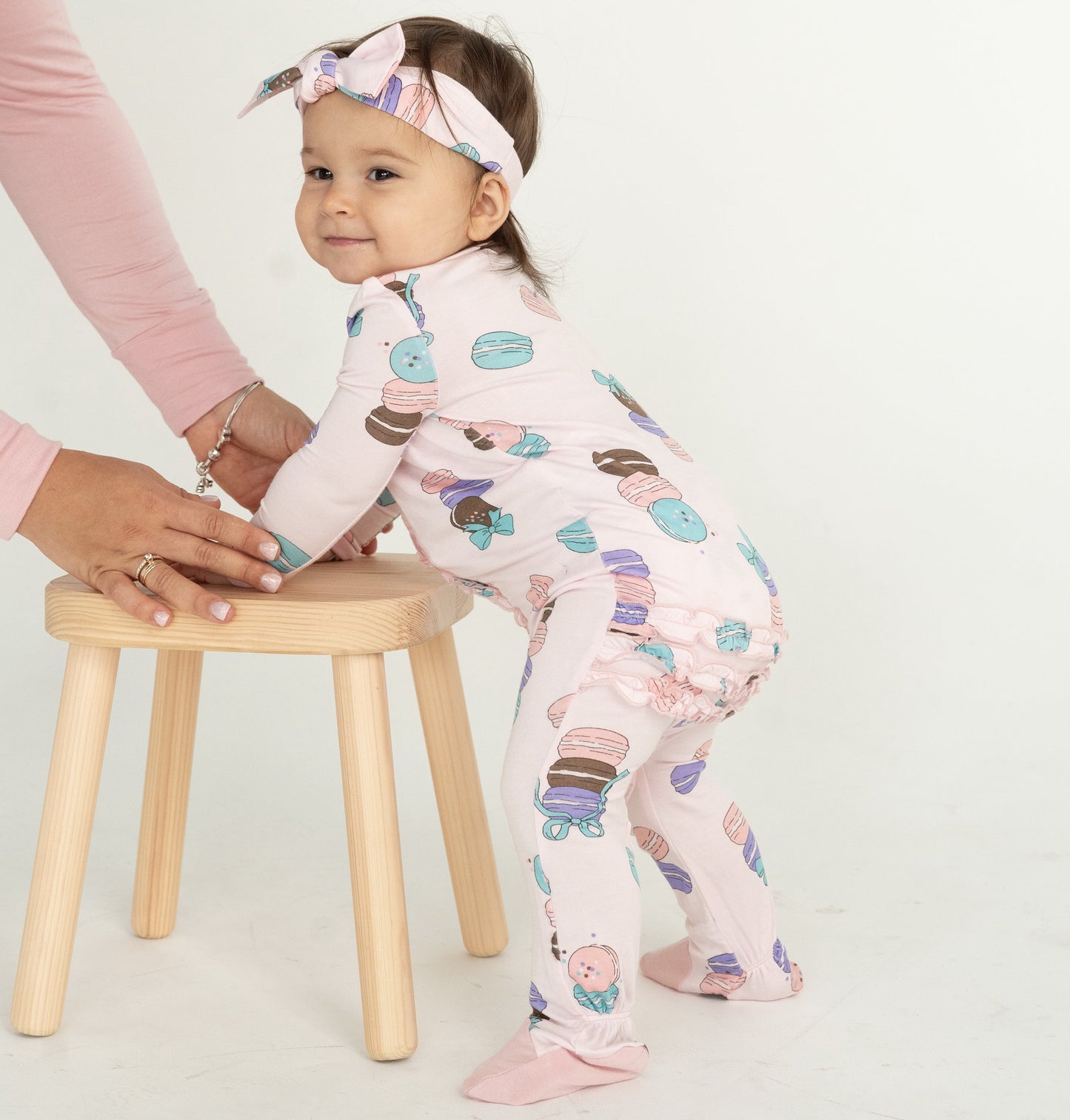 bamboo ruffle footies with two way zipper macaron party print