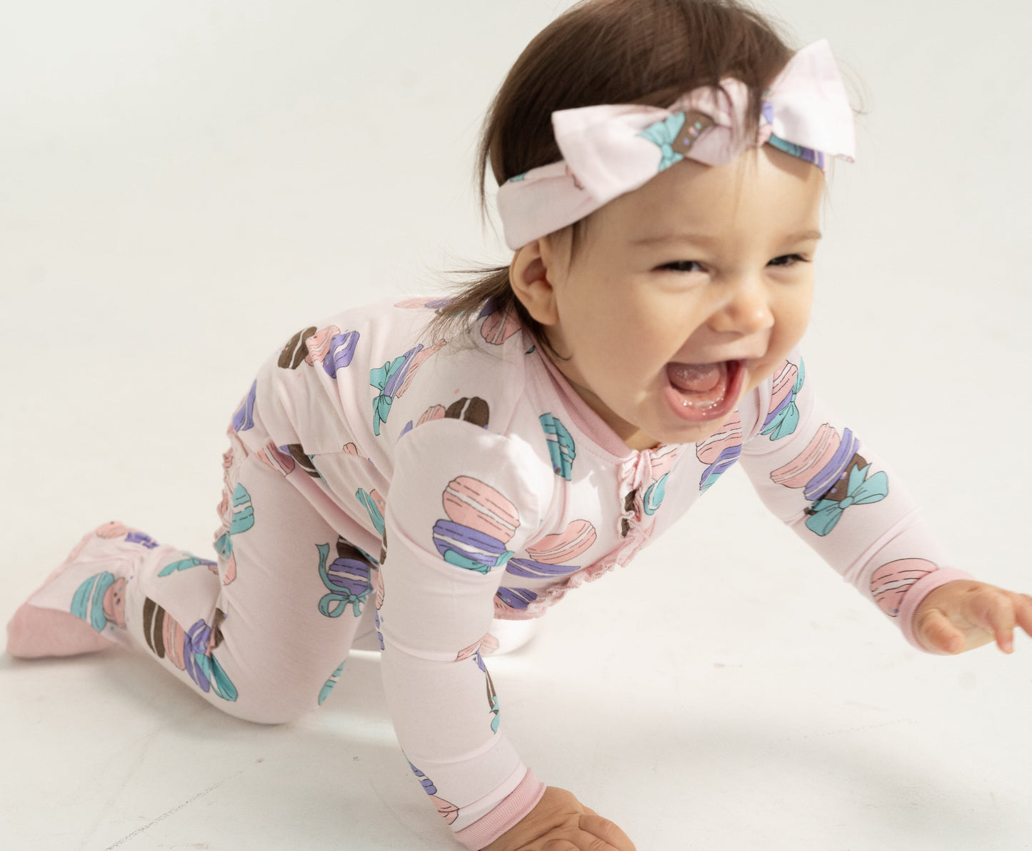 bamboo ruffle footies with two way zipper macaron party print