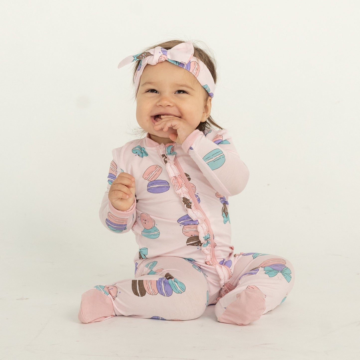 bamboo ruffle footies with two way zipper macaron party print