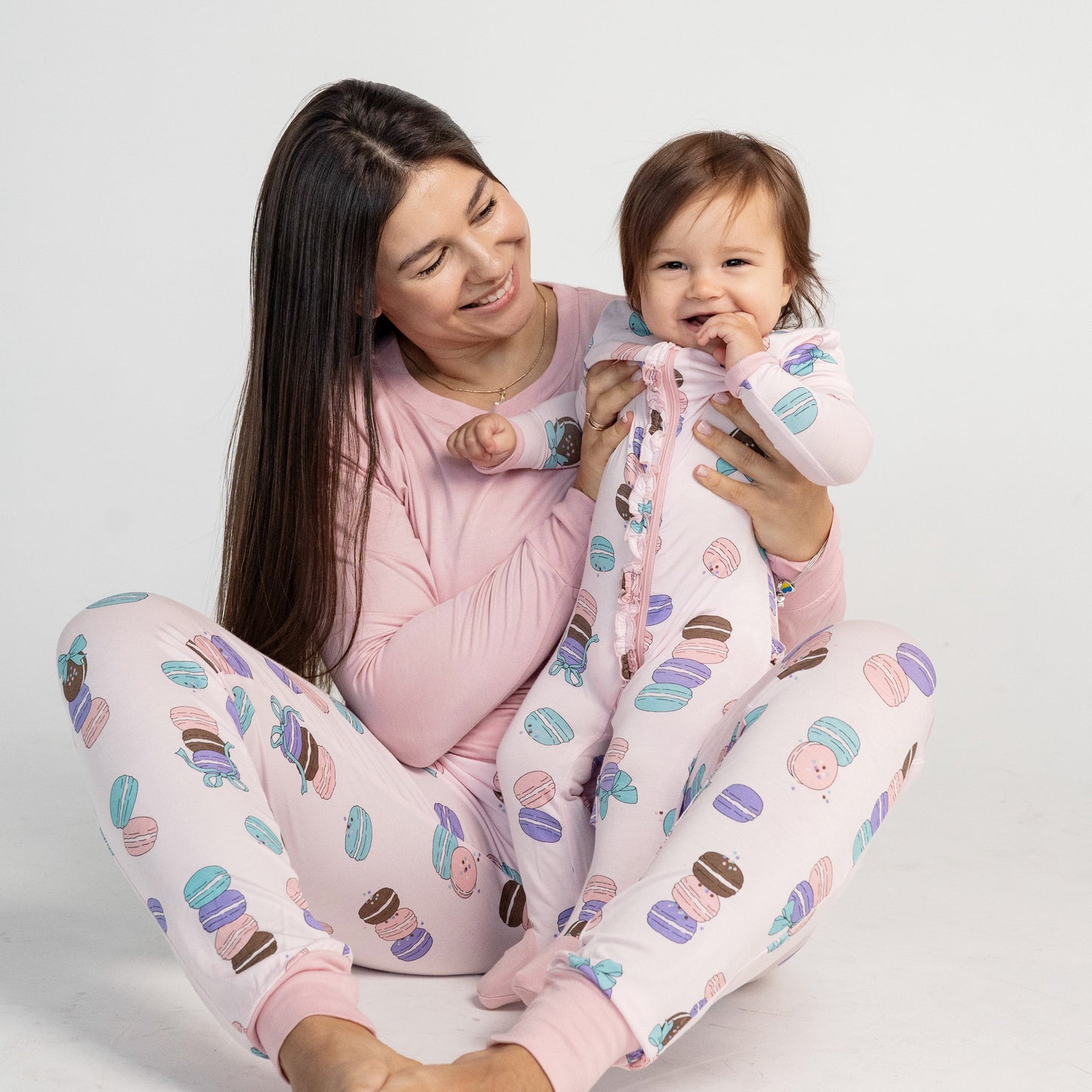 bamboo ruffle footies with two way zipper macaron party print