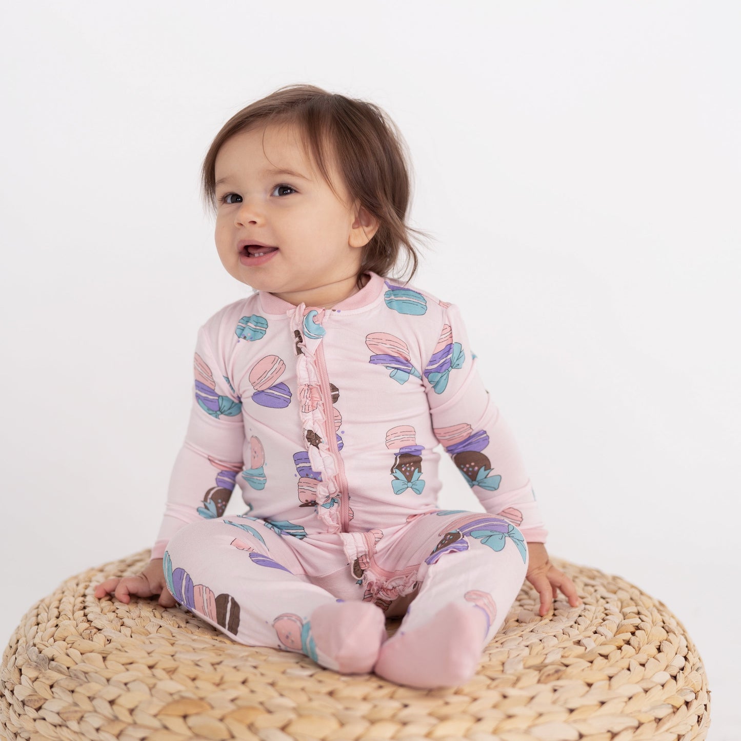 bamboo ruffle footies with two way zipper macaron party print