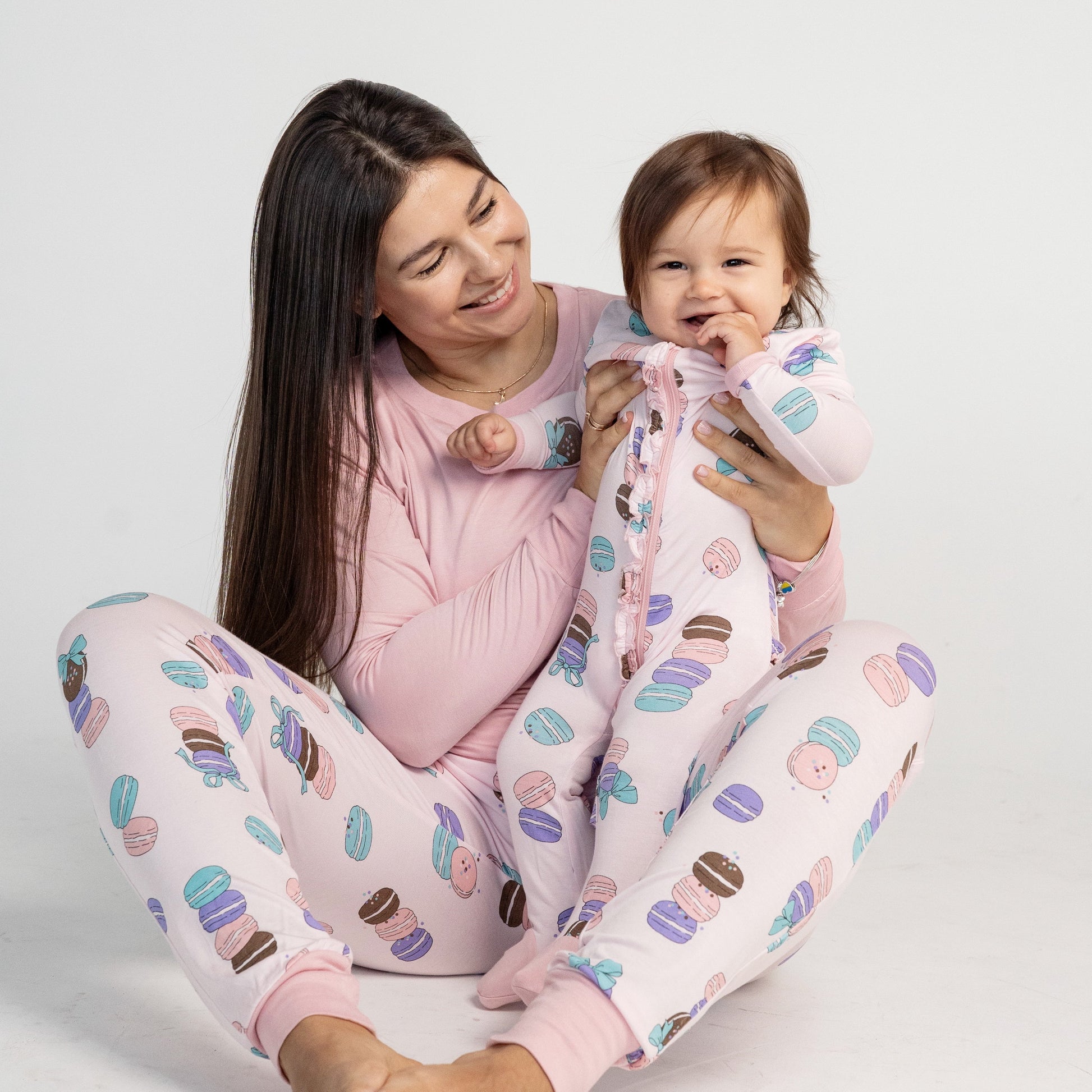 bamboo ruffle footies with two way zipper macaron party print